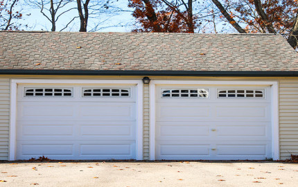 What Might Cause A Garage Door To Jerk Instead Of Opening Smoothly?