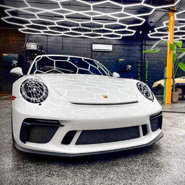 How do LED lights help in spotting faint scratches that are difficult to see?