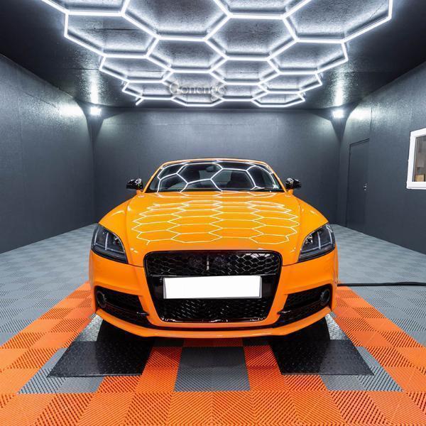 Why do auto shops use LED lights to ensure wheel surfaces are uniformly cleaned and polished?
