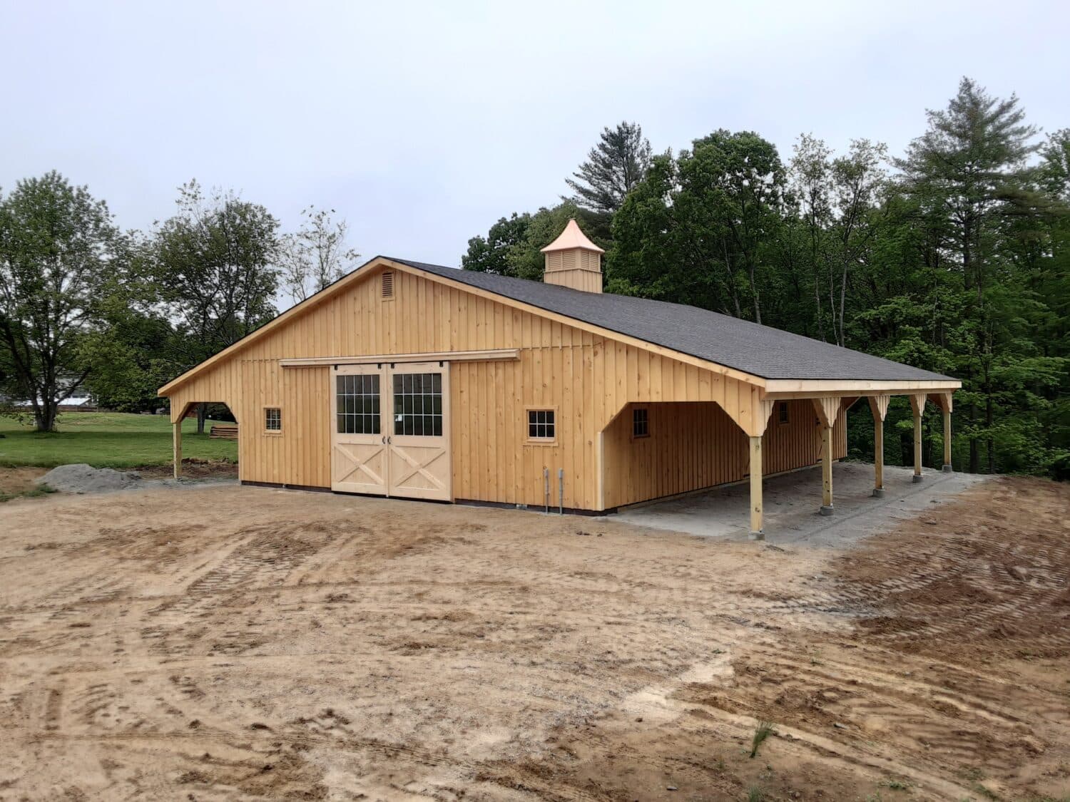 How Custom Horse Barn Construction Elevates Your Property